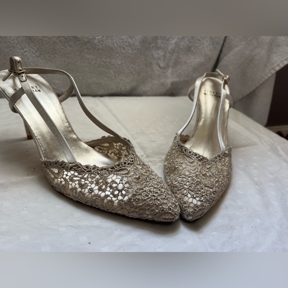 STUART WEITZMAN gold low heel strap shoes.